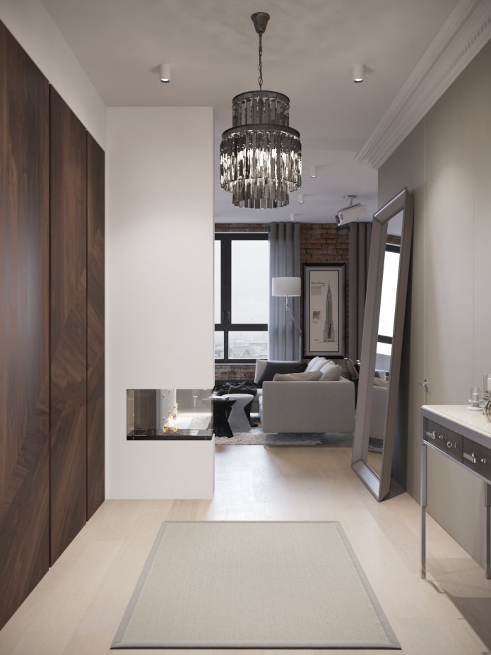 design vstupní haly v kombinaci s obývacím pokojem s krbem