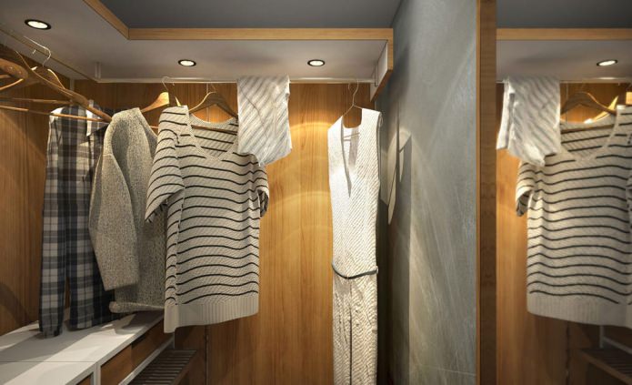 غرفة ملابس في تصميم شقة صغيرة مساحتها 15 مترًا مربعًا. م.
