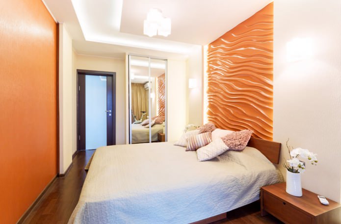 oranssit 3D-paneelit makuuhuoneen seinällä