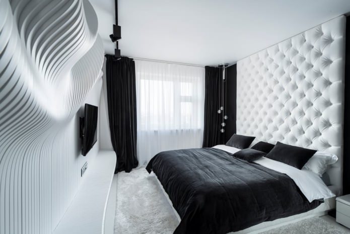 Guļamistabas interjers melnā un baltā krāsā