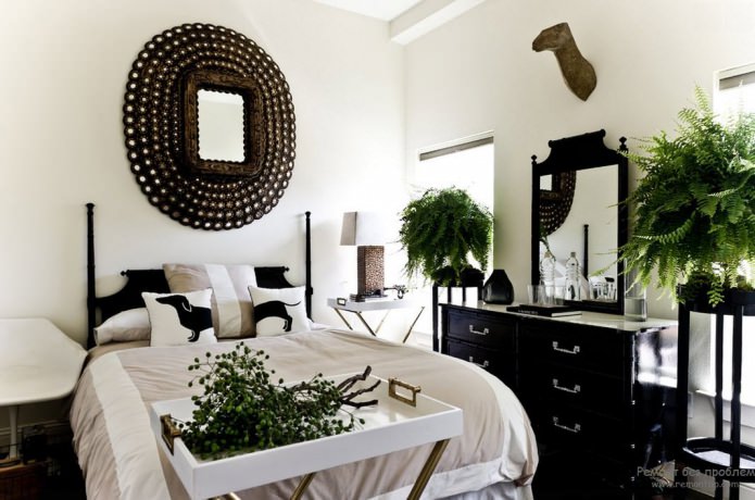 czarno-białe wnętrze sypialni z dodatkiem zieleni