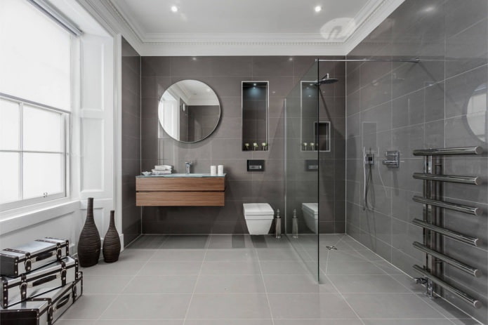 vannas istabas interjers mūsdienīgā stilā ar pelēkām taisnstūrveida flīzēm