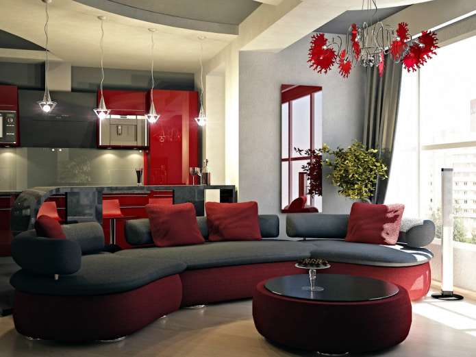 dīvāns ar sarkaniem tekstilizstrādājumiem un pamatni