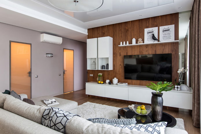 Televizní prostor se dřevěnou stěnou v interiéru
