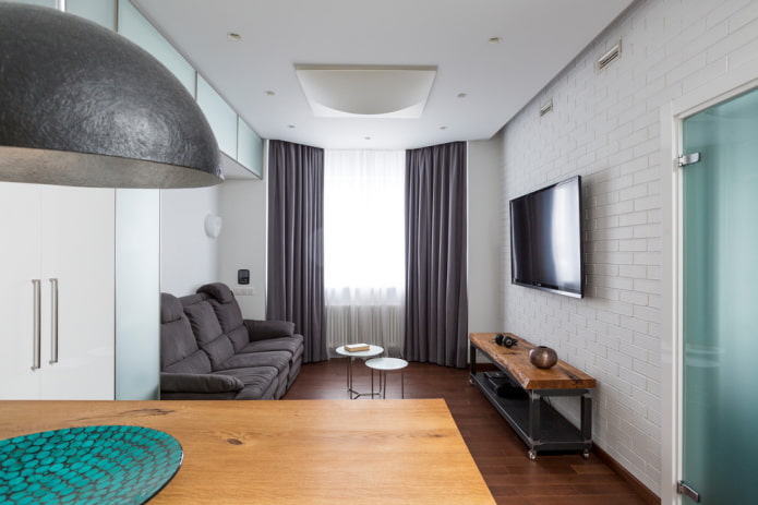 vægmonteret tv i interiøret i en moderne stil