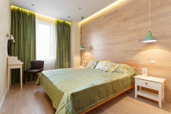 katil dengan sprei hijau di bilik tidur