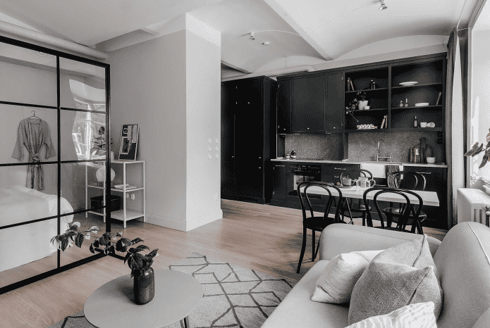 skandinaviško stiliaus studijos tipo apartamentų interjeras