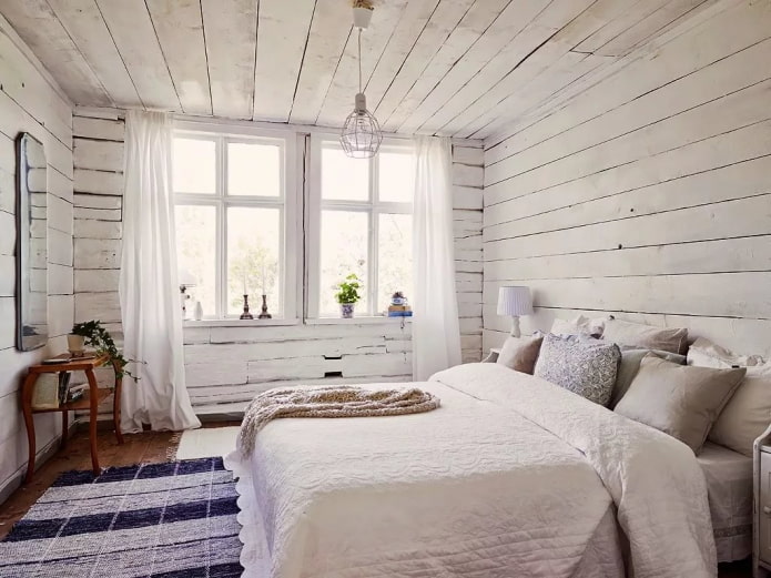 غرفة نوم اسكندنافية في داخل منزل خشبي