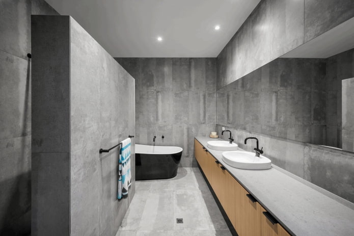 minimalizmo stiliaus pilkas vonios kambario interjeras