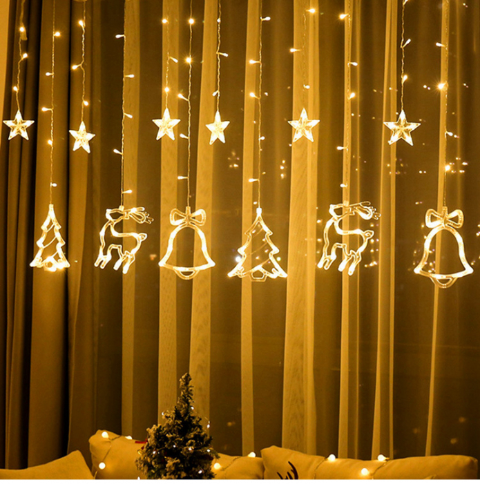 lampu dalam bentuk pokok Krismas dan rusa