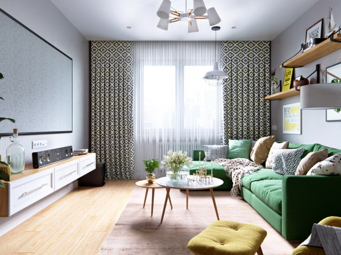 jasny pokój z zieloną sofą