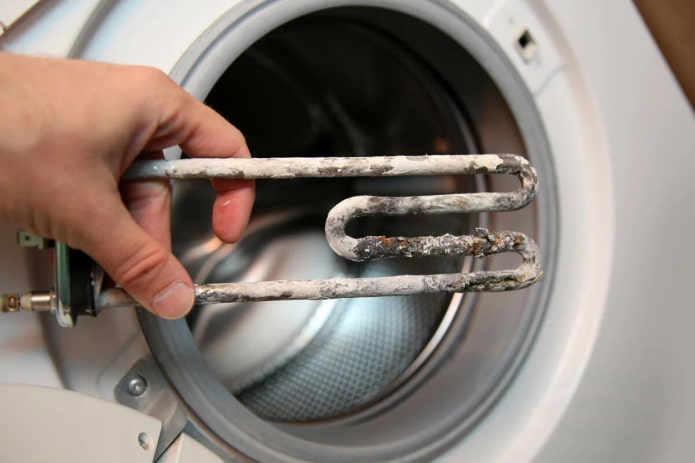 đóng cặn trên bộ phận làm nóng của máy giặt