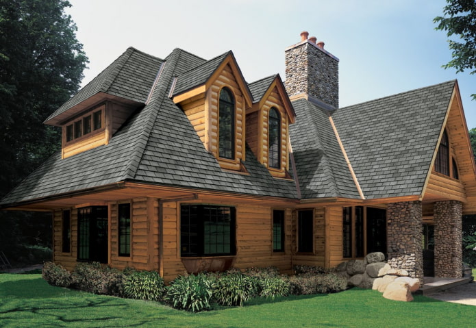 sebuah rumah yang diperbuat daripada kayu balak dengan bumbung lembut