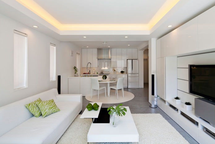 Interiér obývacej izby s kuchyňou v bielej farbe
