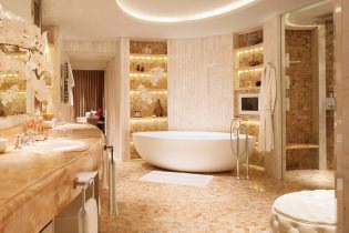 Reka bentuk dalaman bilik mandi dalam warna emas